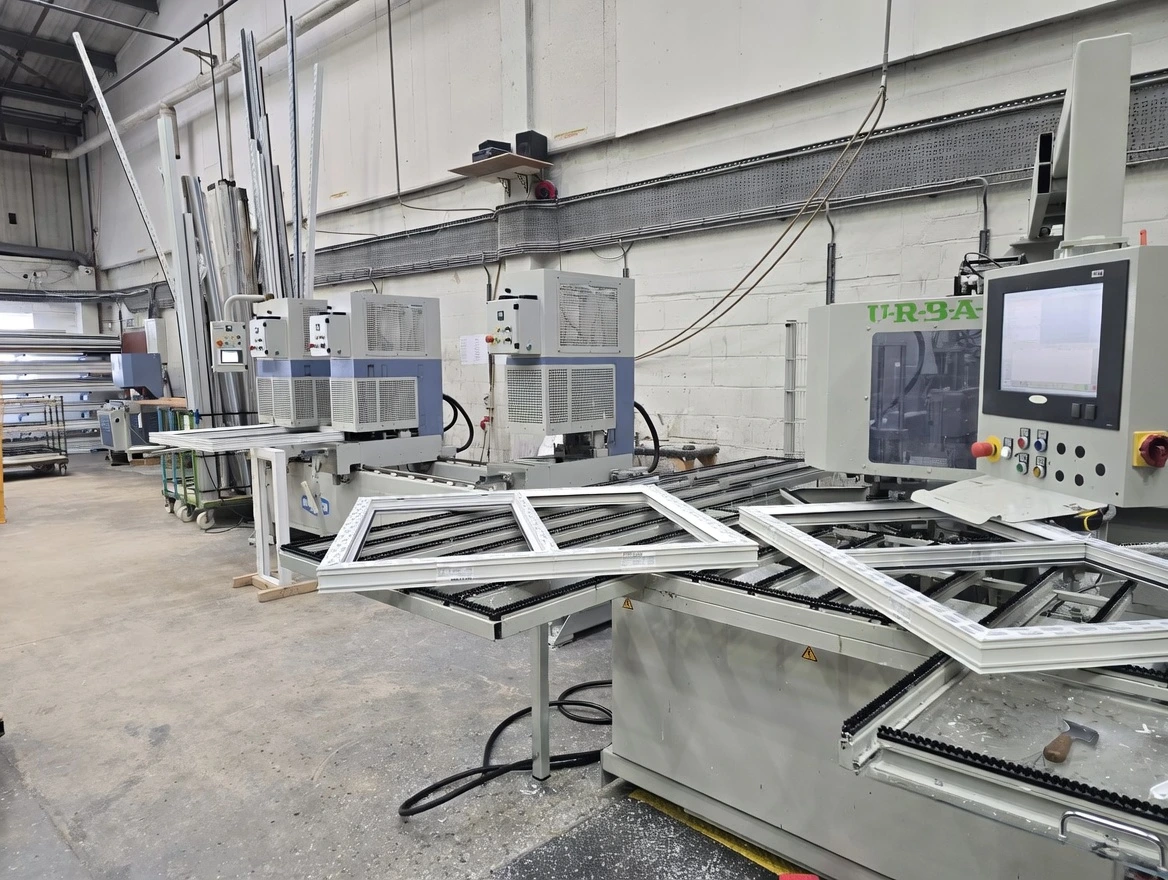Window and door fabrication machinery at the Absolute Window Co Worsley manufacturing facility