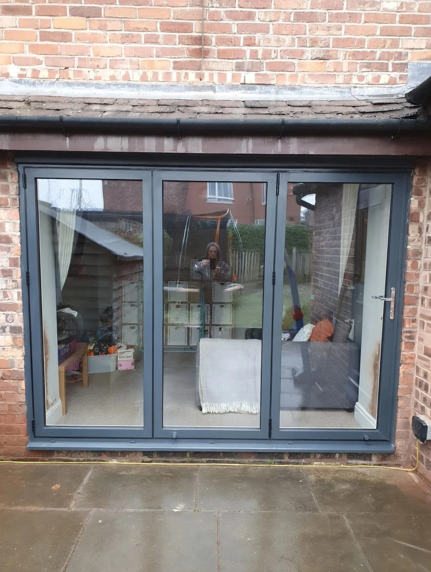 Aluminium bi-fold doors opening onto a garden
